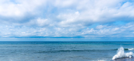 small storm on the sea, waves hitting the shore