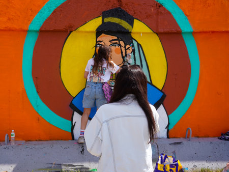 Naberezhnye Chelny, Russia - May 20, 2023 : Festival of street graphics-graffiti, young people, guys and girls, draw on the walls with paintsのeditorial素材
