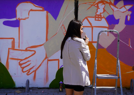 Naberezhnye Chelny, Russia - May 20, 2023 : Festival of street graphics-graffiti, young people, guys and girls, draw on the walls with paintsのeditorial素材