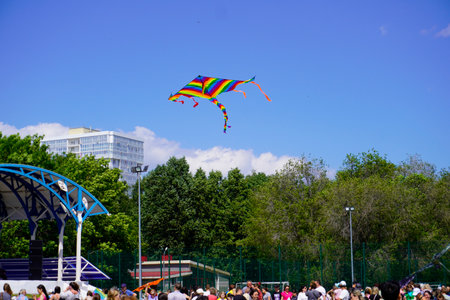 Naberezhnye Chelny, Russia - June 1, 2023 : People celebrate the holiday of summer and childhood in the park, children and adults fly kites.のeditorial素材