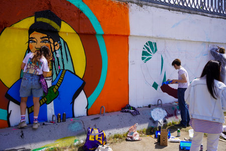 Naberezhnye Chelny, Russia - May 20, 2023 : Festival of street graphics-graffiti, young people, guys and girls, draw on the walls with paintsのeditorial素材