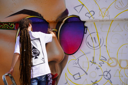 Naberezhnye Chelny, Russia - May 20, 2023 : Festival of street graphics-graffiti, young people, guys and girls, draw on the walls with paintsのeditorial素材