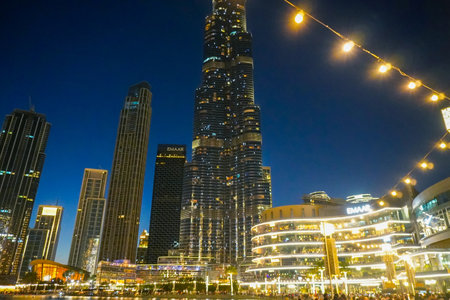 Dubai, UAE - March,18,2023: Dubai streets, houses and skyscrapers, view at night , Burj Khalifaのeditorial素材