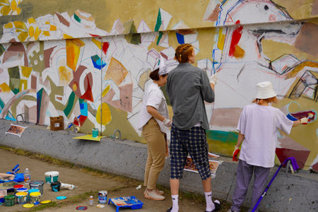 Naberezhnye Chelny, Russia - May 20, 2023 : Festival of street graphics-graffiti, young people, guys and girls, draw on the walls with paintsのeditorial素材