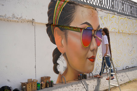 Naberezhnye Chelny, Russia - May 20, 2023 : Festival of street graphics-graffiti, young people, guys and girls, draw on the walls with paintsのeditorial素材