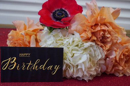 postcard , Internet banner with a birthday greeting, with the inscription - happy birthday, a bouquet of flowers with a note of congratulationsの写真素材