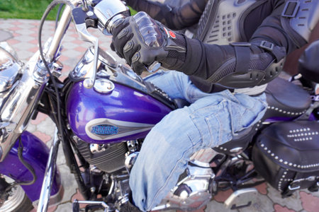 Nab. Chelny, Russia - August 26, 2023: motorcyclist on a motorcycle Harley-Davidson Softail Heritage close-upのeditorial素材