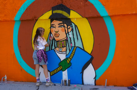 Naberezhnye Chelny, Russia - May 20, 2023 : Festival of street graphics-graffiti, young people, guys and girls, draw on the walls with paintsのeditorial素材