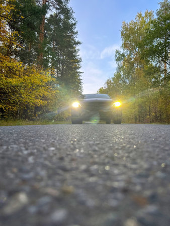 Naberezhnye Chelny, Russia - October 1, 2023: Mercedes-Benz E200 car stands on the road in the autumn forestのeditorial素材