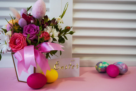 Happy Easter! Flat Lay, postcard or Internet banner with Copy Space on Easter. Bouquet of flowers and Easter eggsの写真素材