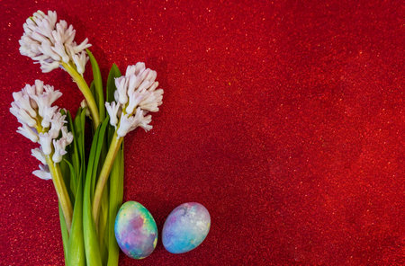 Happy Easter! Flat Lay, postcard or Internet banner with Copy Space on Easter, Bouquet of flowers and Easter eggsの写真素材