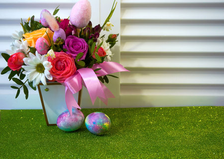 Happy Easter! Flat Lay, postcard or Internet banner with Copy Space on Easter. Bouquet of flowers and Easter eggsの写真素材