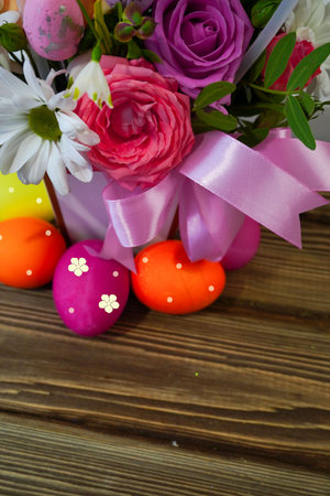 Happy Easter! Flat Lay, postcard or Internet banner with Copy Space on Easter. Bouquet of flowers and Easter eggsの写真素材