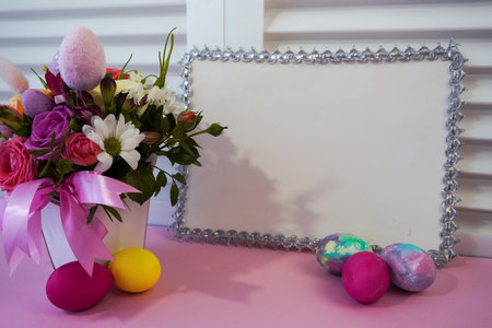 Happy Easter! Flat Lay, postcard or Internet banner with Copy Space on Easter. Bouquet of flowers and Easter eggsの写真素材