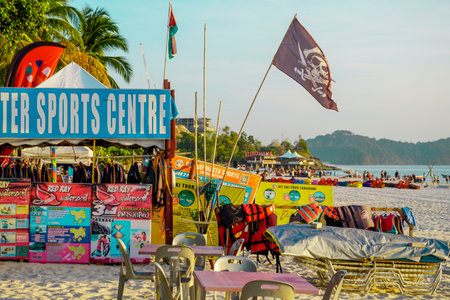 Langkawi, Malaysia - January 29, 2024 : Langkawi island in Malaysia, Chenang beach in the evening, people walk along the beachのeditorial素材