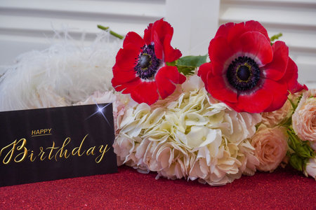 postcard , Internet banner with a birthday greeting, with the inscription - happy birthday, a bouquet of flowers with a note of congratulationsの写真素材