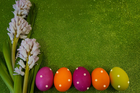 Happy Easter! Flat Lay, postcard or Internet banner with Copy Space on Easter, Bouquet of flowers and Easter eggsの写真素材