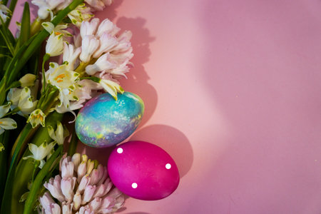 Happy Easter! Flat Lay, postcard or Internet banner with Copy Space on Easter, Bouquet of flowers and Easter eggsの写真素材
