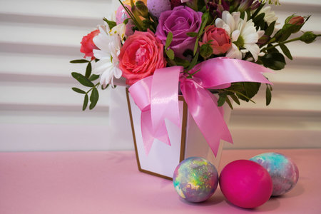 Happy Easter! Flat Lay, postcard or Internet banner with Copy Space on Easter. Bouquet of flowers and Easter eggsの写真素材