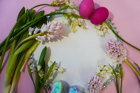 Happy Easter! Flat Lay, postcard or Internet banner with Copy Space on Easter, Bouquet of flowers and Easter eggsの写真素材