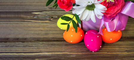 Happy Easter! Flat Lay, postcard or Internet banner with Copy Space on Easter. Bouquet of flowers and Easter eggsの写真素材