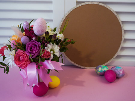Happy Easter! Flat Lay, postcard or Internet banner with Copy Space on Easter. Bouquet of flowers and Easter eggsの写真素材