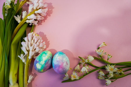 Happy Easter! Flat Lay, postcard or Internet banner with Copy Space on Easter, Bouquet of flowers and Easter eggsの写真素材