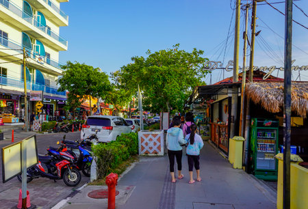 Langkawi, Malaysia - January 29, 2024 : Streets of Langkawi island in Malaysia, Chenang beach area, shops and hotels, people walking down the streetのeditorial素材