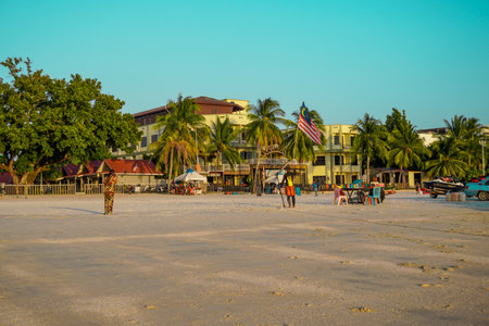Langkawi, Malaysia - January 29, 2024 : Langkawi island in Malaysia, Chenang beach in the evening, people walk along the beachのeditorial素材