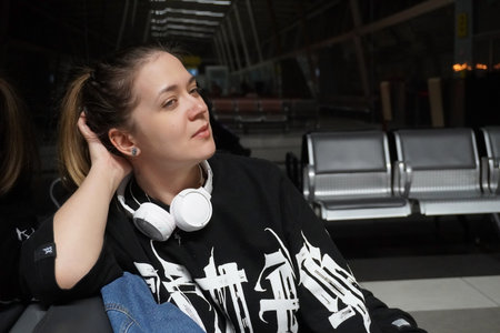 young beautiful woman at the airport goes on a trip,