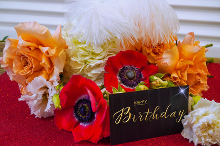 postcard , Internet banner with a birthday greeting, with the inscription - happy birthday, a bouquet of flowers with a note of congratulationsの写真素材