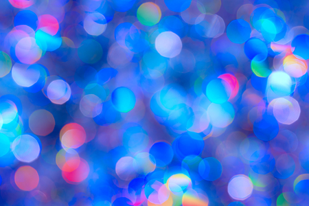 Abstract Christmas backdrop. Blue background of blur colorful texture bokeh for Festival and New year. Game of color.の写真素材