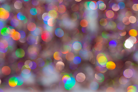 Abstract Christmas dark backdrop. Background of blur colorful texture bokeh for Festival and New year. Game of color.の写真素材