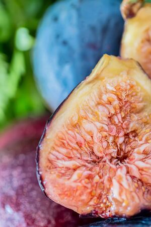 Fresh juicy figs fruit. Macro half a fig. Shallow depth of field. Toned image. Nature Blurry background. Copy space. Art photography. Closeupの写真素材
