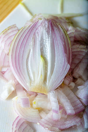 Top view of half a raw purple onion. Chopped onion. Vegetarian healthy food. Shallow depth of field.の写真素材