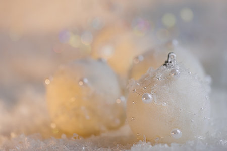 Merry christmas postcard. New Year, beautiful gray blurred background with white balls with pearls and colored bokeh.の写真素材