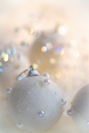 Christmas. New Year, beautiful glowing blurred background with white balls with pearls and bokeh. Copy space.の写真素材