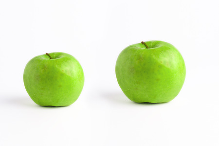 Green apples isolated on white background. The fresh green apples in a white background. The grupe of the green apples.の写真素材