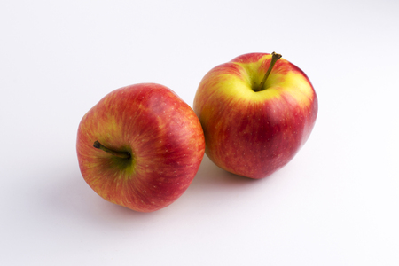 Apples on a white background. A group of apples on an isolated white background. Fruits on a white background.の写真素材