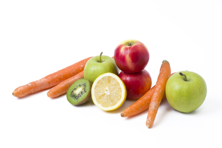 Fruits on a white background. Lemon with apples and kiwi on white background. Kiwi with lemon on a white background. Carrots with fruits on a white background.の写真素材