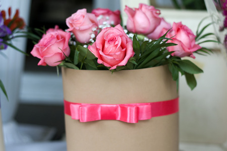 Beautiful bouquet of roses in a gift box. Bouquet of pink roses. Pink roses close-up.の写真素材