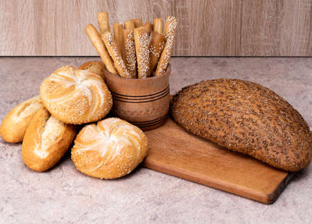 Ð¡risp bread with buns. French baguettes. Fresh crispbread. Bread background. Different breed on...