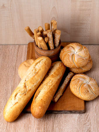 Ð¡risp bread with buns. French baguettes. Fresh crispbread. Bread background. Different breed on...