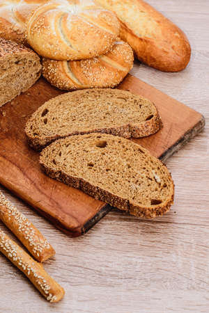 Ð¡risp bread with buns. French baguettes. Fresh crispbread. Bread background. Different breed on...