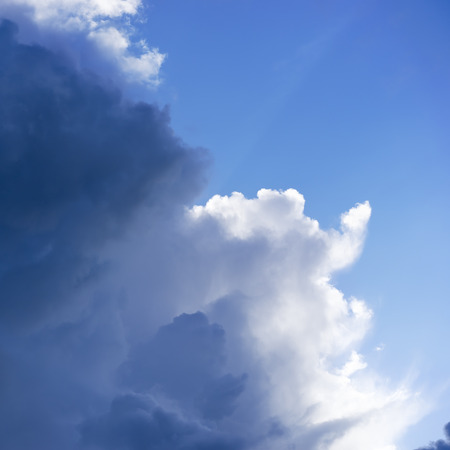 Stormy clouds against crystal blue skyの写真素材