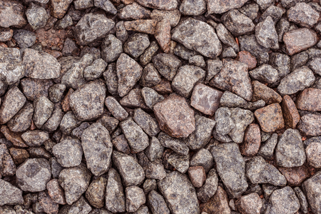 Crushed stone as a background, gray, redの写真素材