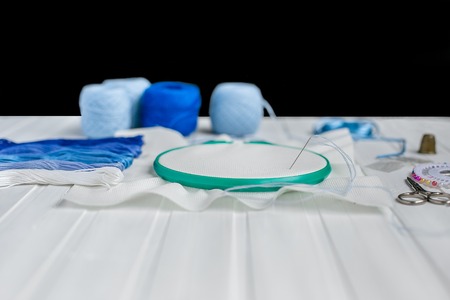 Set for embroidery, embroidery hoop, linen fabric, thread, scissors, embroidered needle bed.