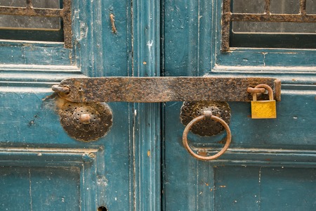 Old wooden doors, metal handles.の写真素材