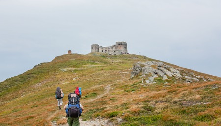 Tourists on the trail in the mountains. Panoramic view of the rocky mountains of the Carpathians,...
