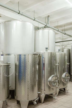 Modern winery. Big stainless steel reservoirs for the fermentation of wine.